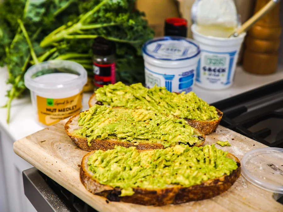 Avocado toast topped with sliced avocado.