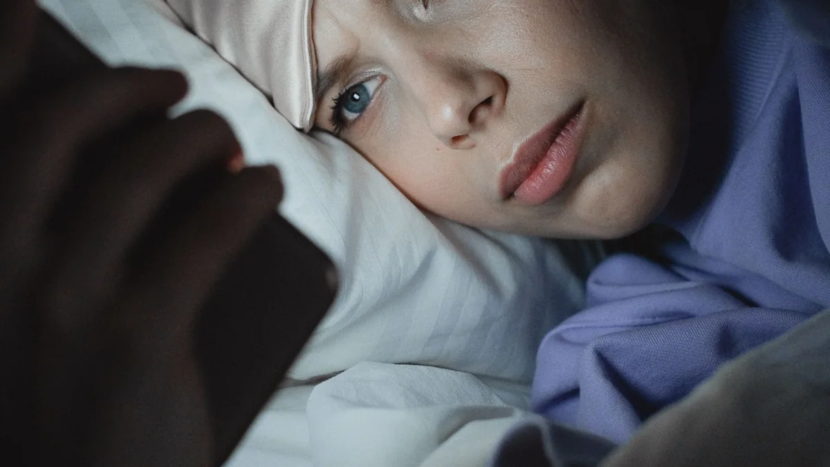Person receiving a phone reply later in the day