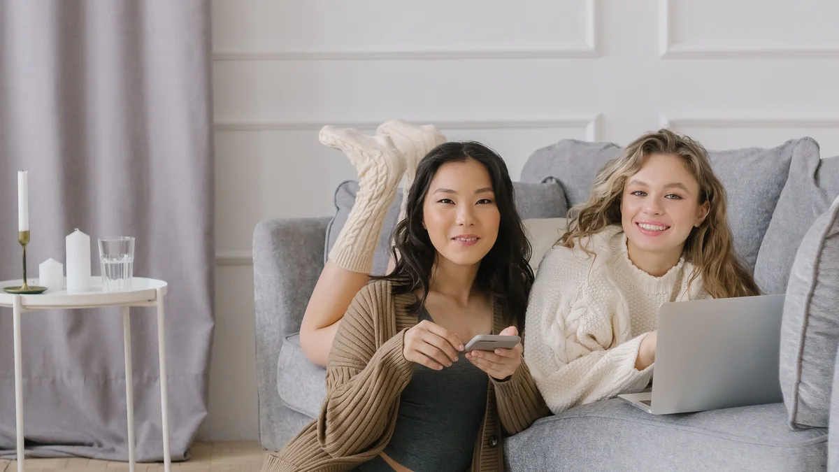 Two people talking casually with a phone nearby