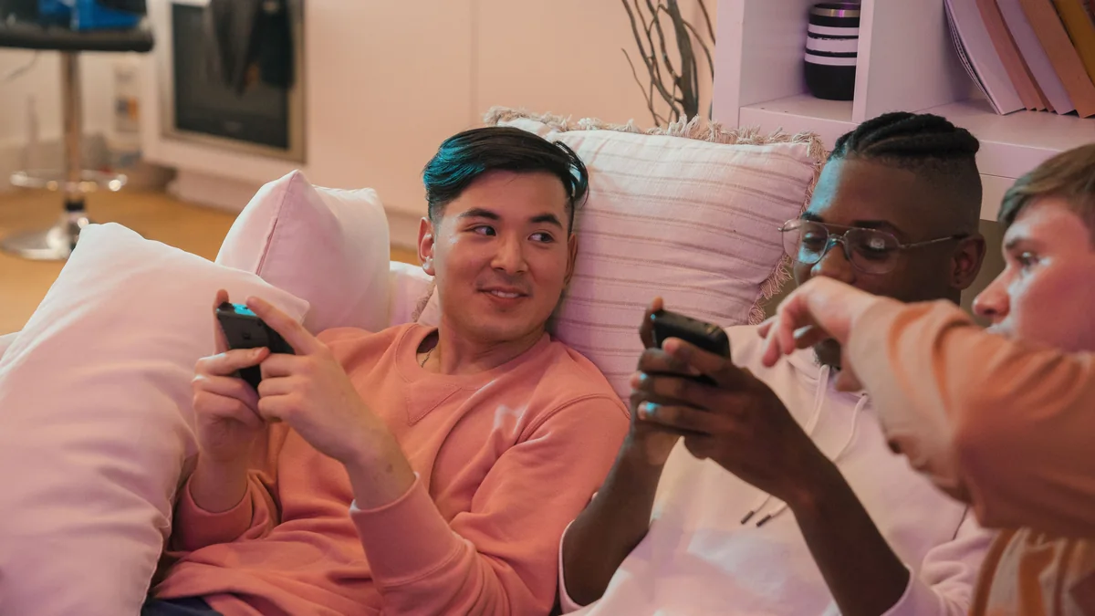 Friends actively chatting together and sharing messages on smartphones