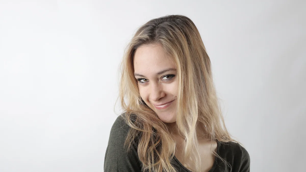 Person giving a knowing amused expression during a conversation
