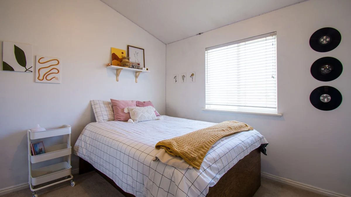 Clean and organized bedroom with cozy modern decor