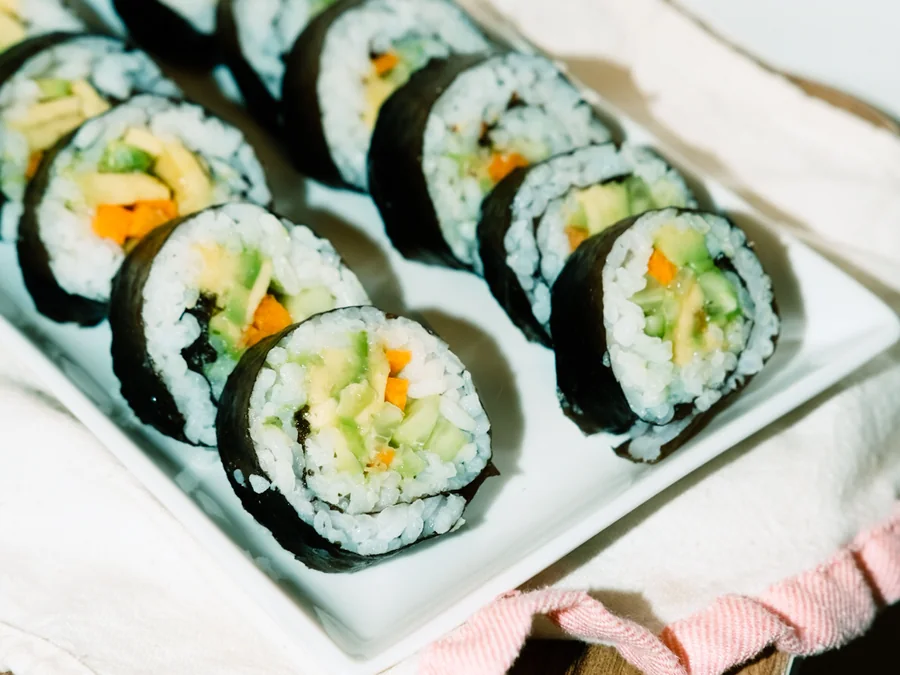 Vegetable sushi rolls filled with avocado and vegetables.