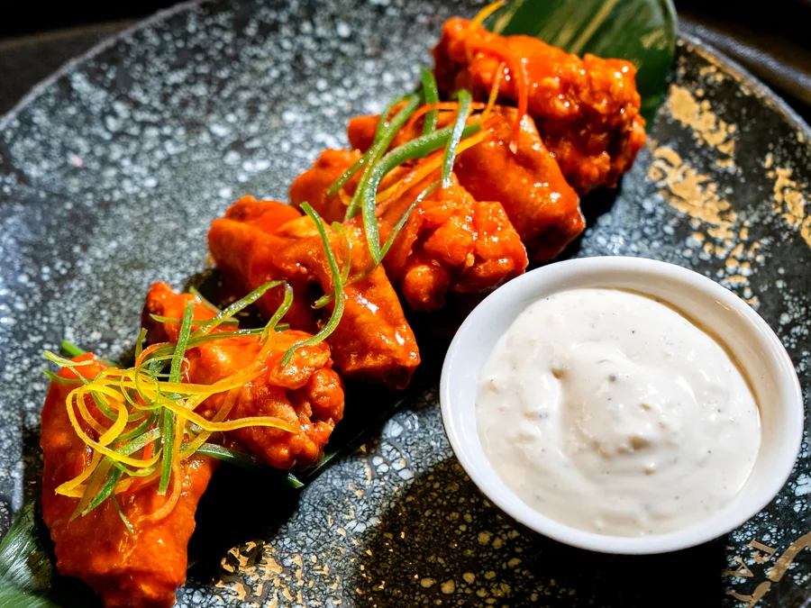 Buffalo-style chicken wings.