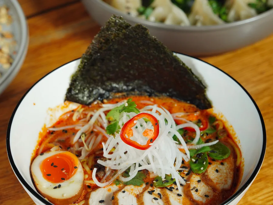 A bowl of spicy ramen noodles.