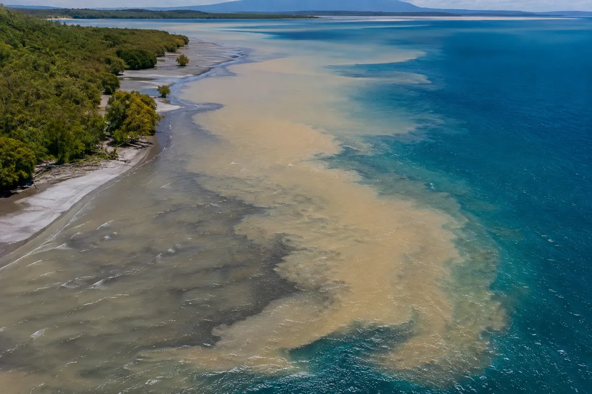 Fresh river water mixing with salty seawater at a coastal estuary